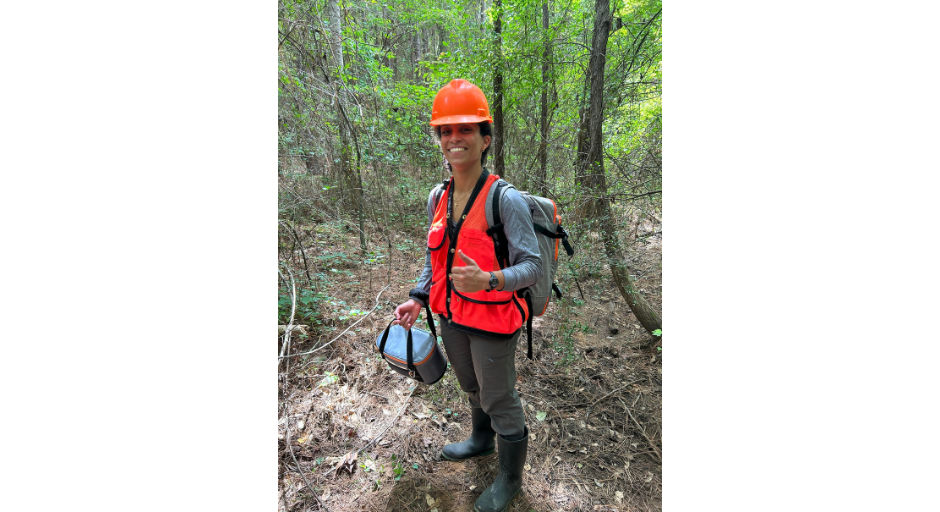 An image of Elizabeth Basha in the woods.
