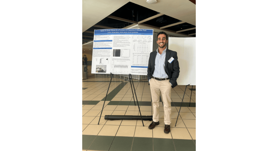 An image of Michael with his presentation "Speed of Shear Waves as a Function of Frequency in Micellar Fluid". 