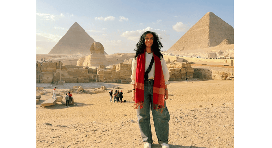 An image of Sarah Basha in front of the pyramids in Egypt