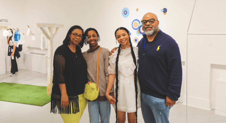 Rory Randle pictured with her family at her 2025 Senior Thesis exhibition.