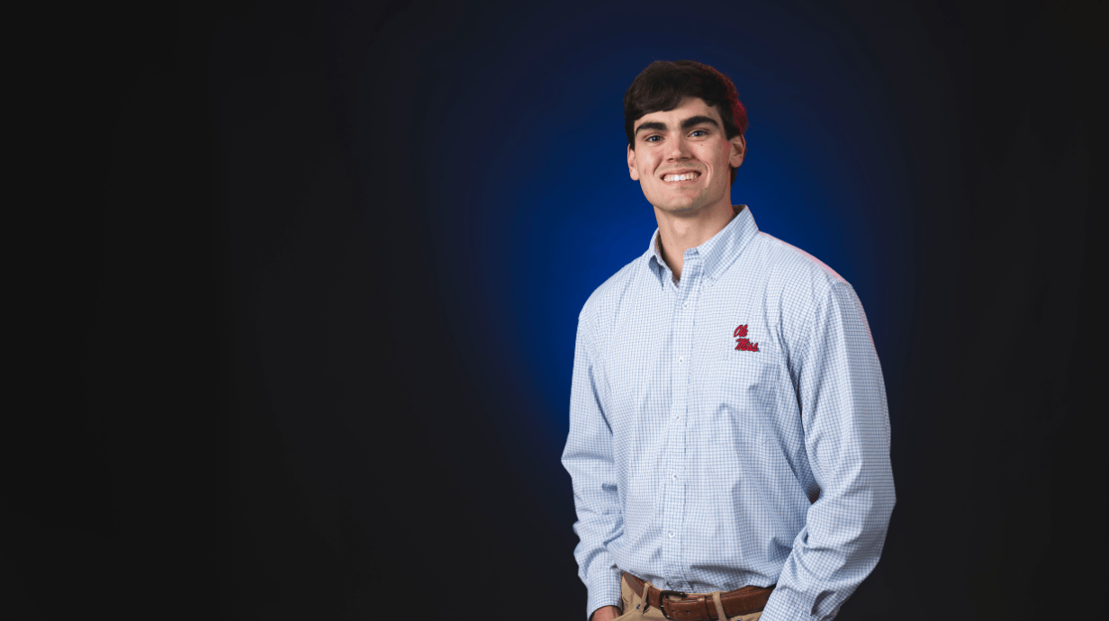 An image of Shane Houston Stephens in front of a blue backdrop.
