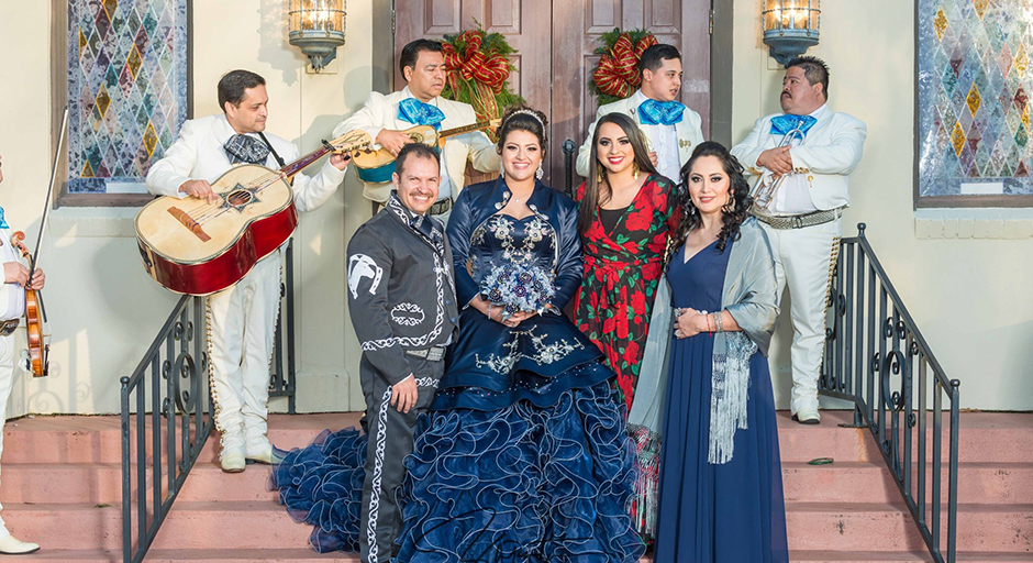 Musicians surround Sofia Euyoque and her family as they celebrate her quinceañera.