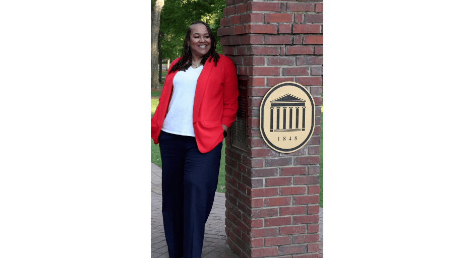 Image of Vernita Ivy leaning against the Walk of Champions.