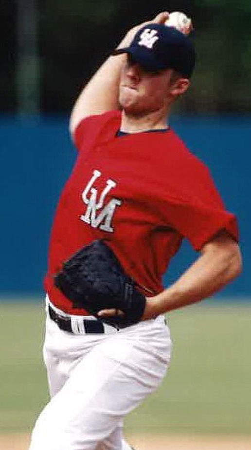 A baseball pitcher wearing Ole Miss gear starts his throw.