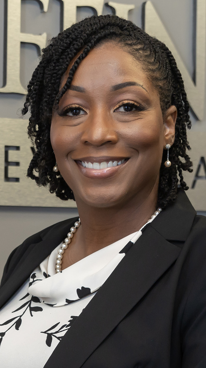 Headshot of a woman dressed in professional attire.