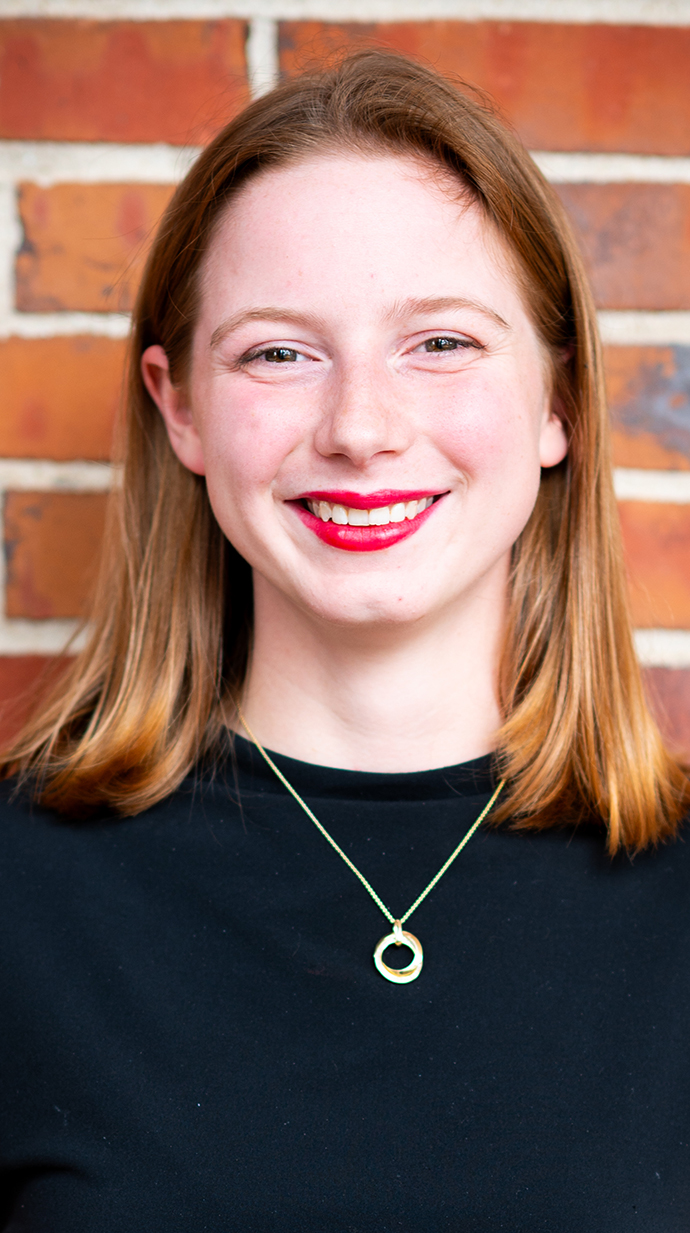 Headshot of a young woman wearing a black sweater.