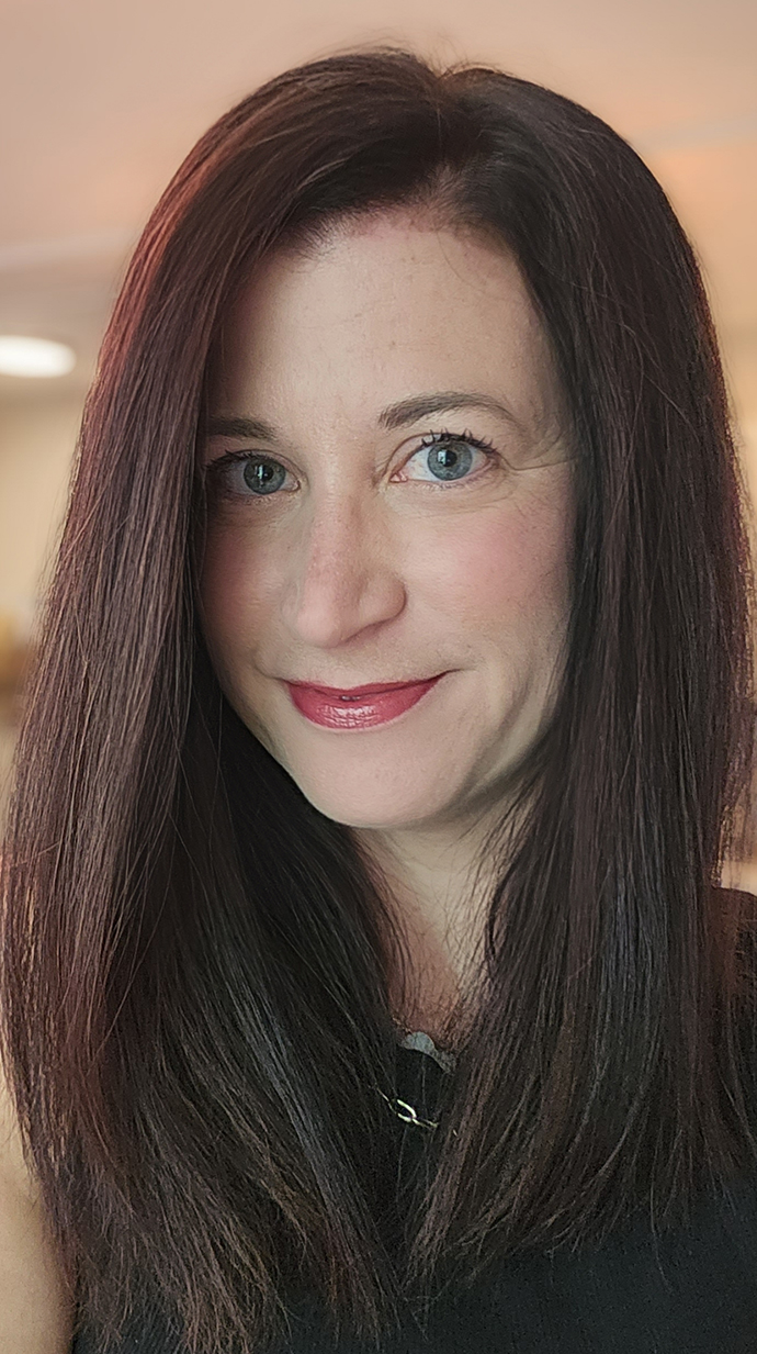 Headshot of a woman wearing a black sweater.