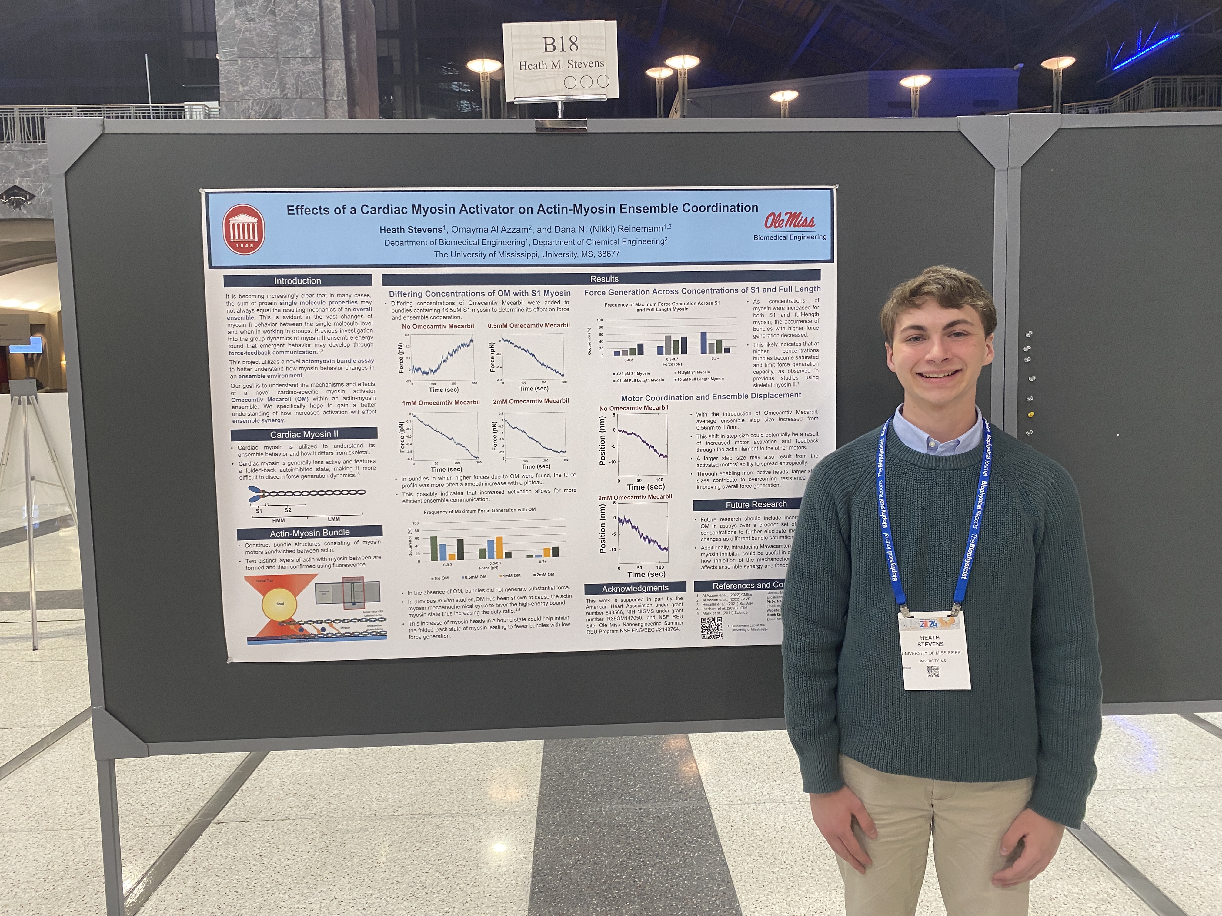 Image of Heath Stevens in front of his research presentation.