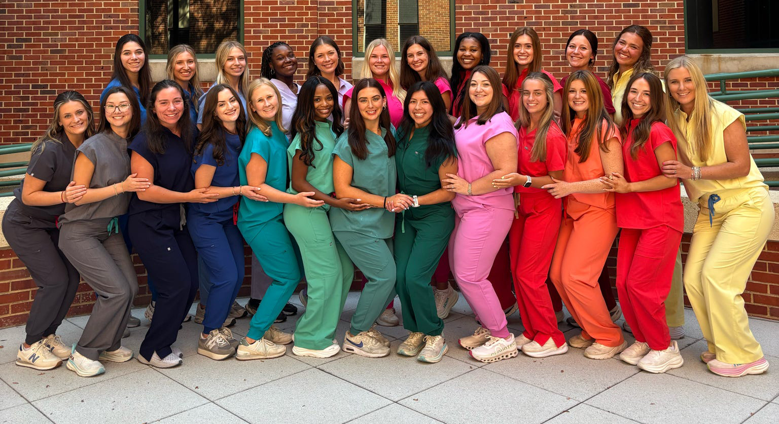 Group of pharmacy students in scrubs