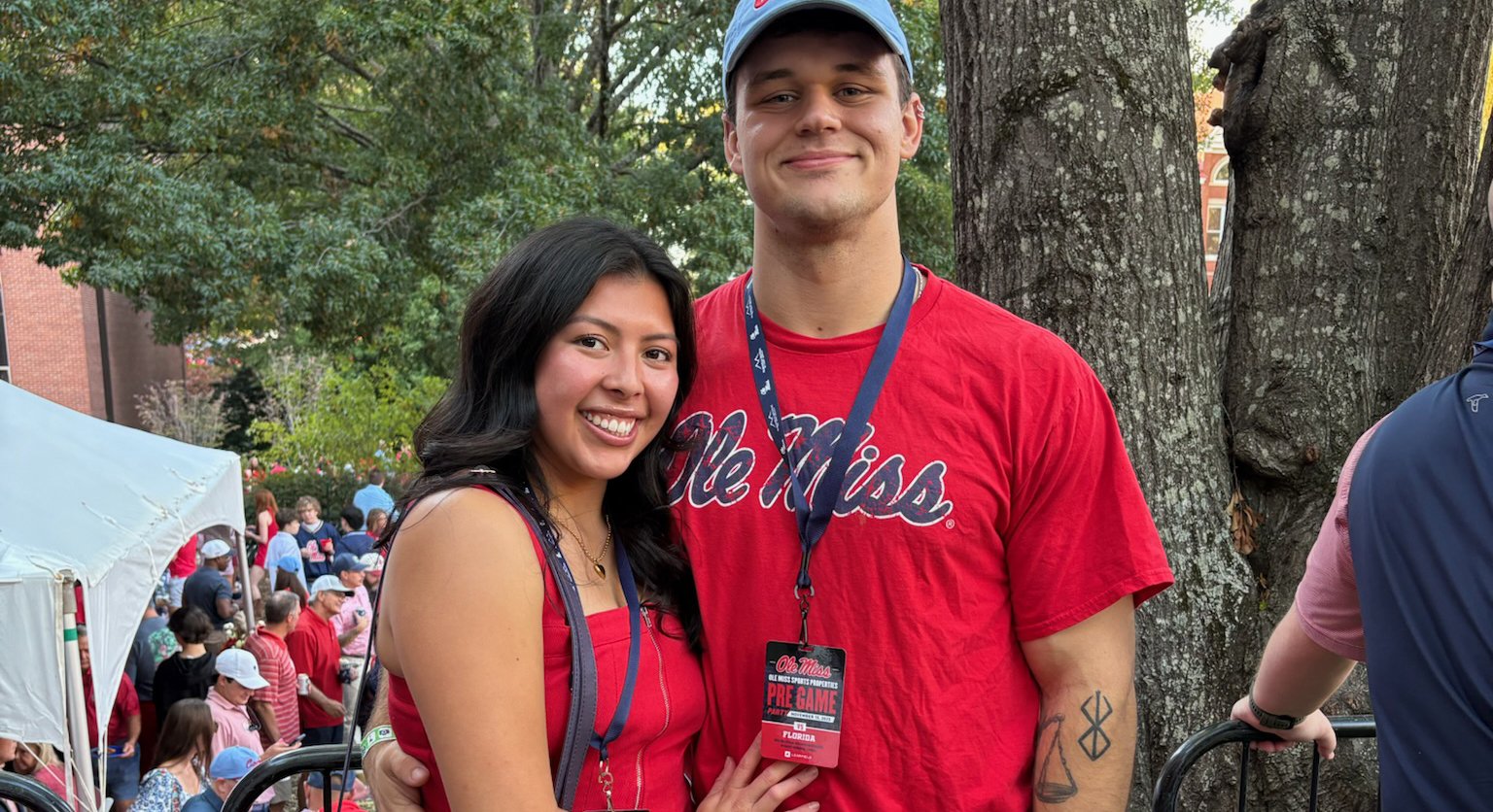 Sydney Ben takes a photo with her boyfriend in the Grove.