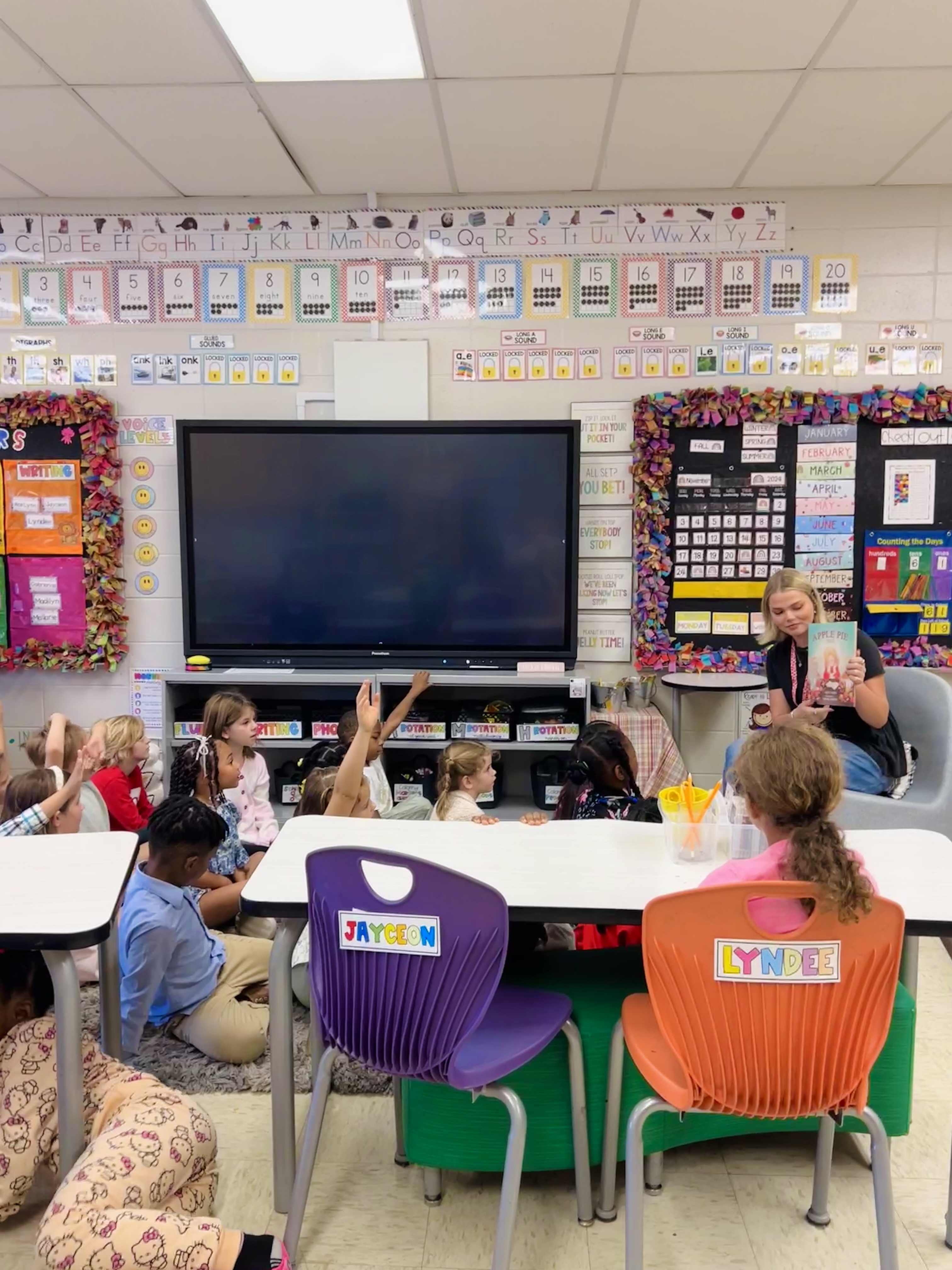 Sydney Dodd reads to a class.
