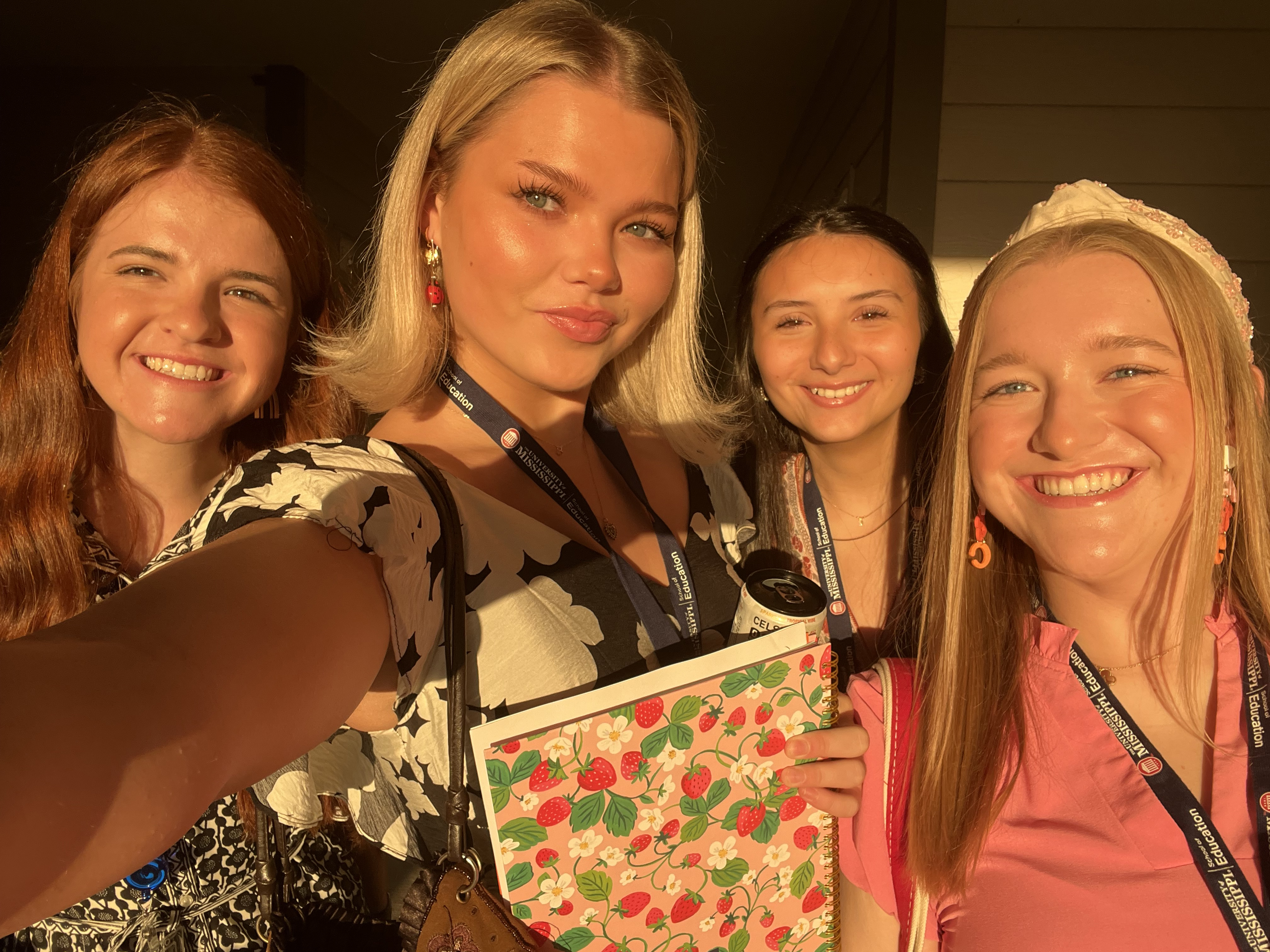 Sydney Dodd poses for a photo with three friends.