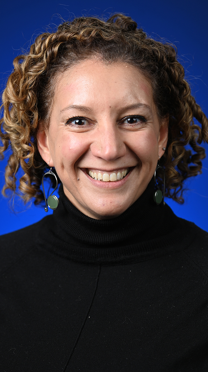 Headshot of a woman wearing a black turtleneck.