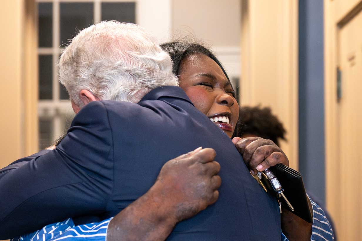 Chancellor Glenn Boyce surprises the university's 21st Truman Scholar, Aminata Ba, in his office. 