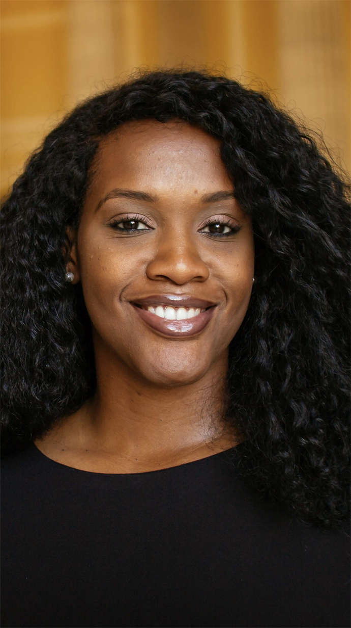 Headshot of a young woman wearing a black blouse.