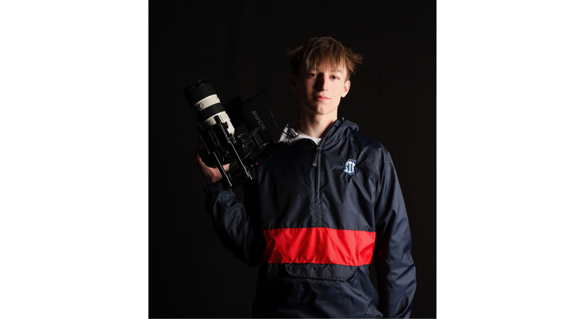 An image of Griffen Hinkle holding a camera.