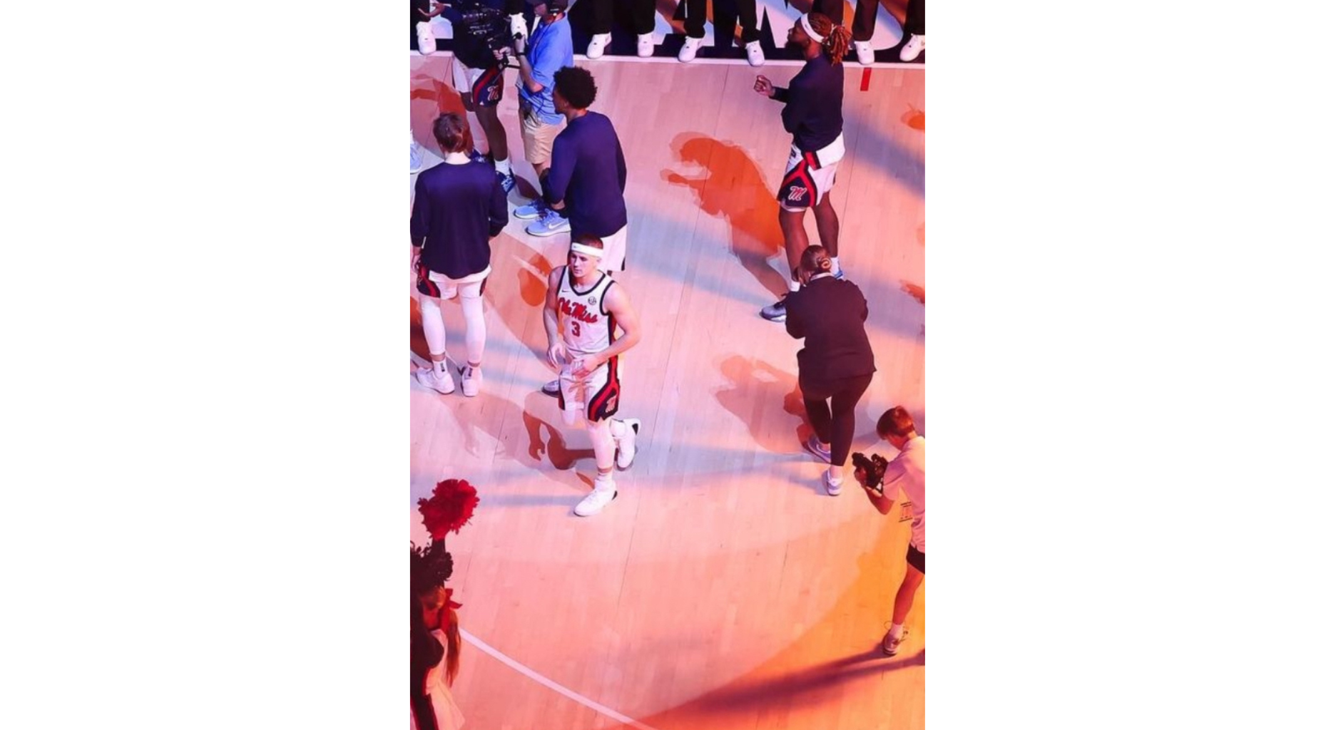 An image of Griffen Hinkle shooting content on the basketball court during pregame.