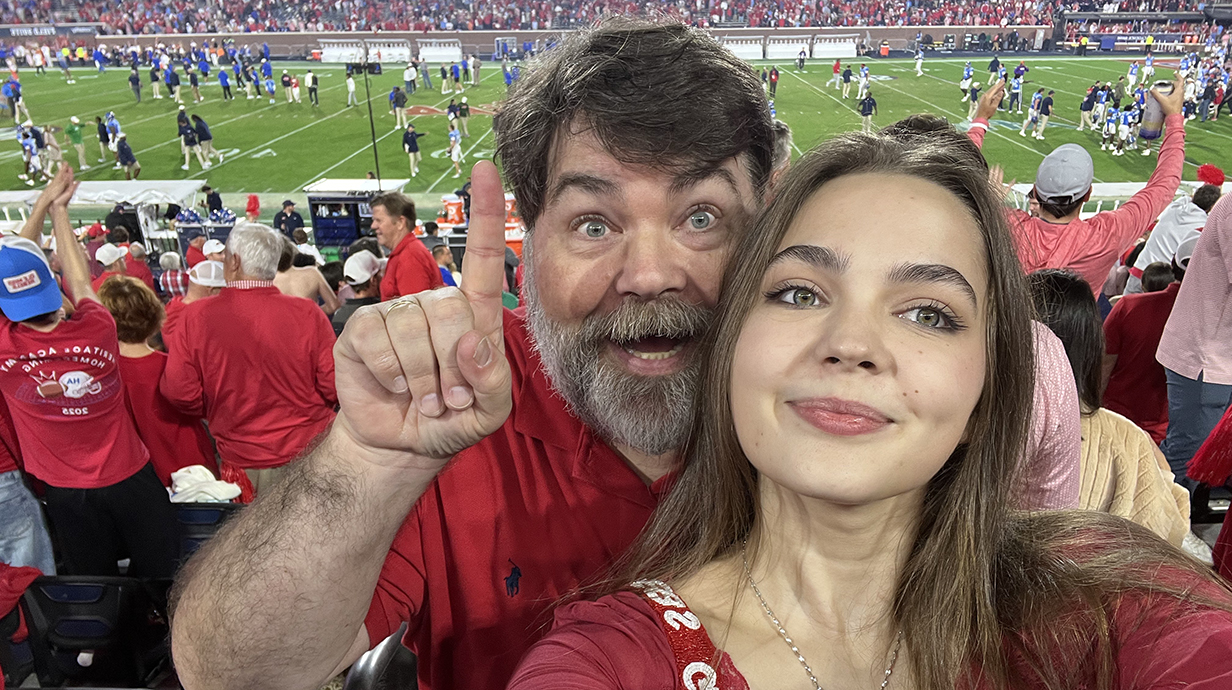 Kesler Smith and her dad, Whitman Smith at a football game.