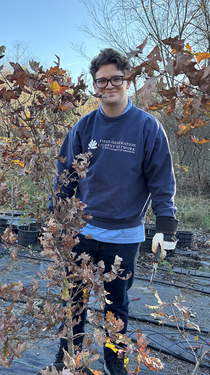 Noah Watts volunteering at Hill Country Roots.