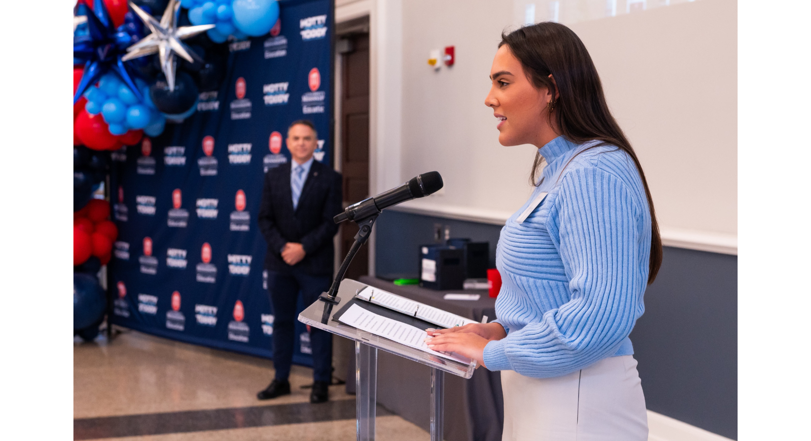 Image of Sam Sepe speaking at a podium.
