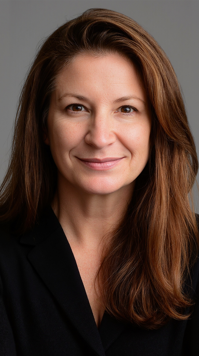 Headshot of a woman wearing a black jacket.