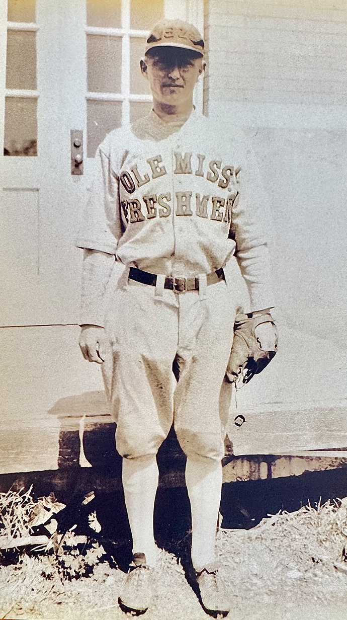 Vintage photo of a man wearing a baseball uniform.
