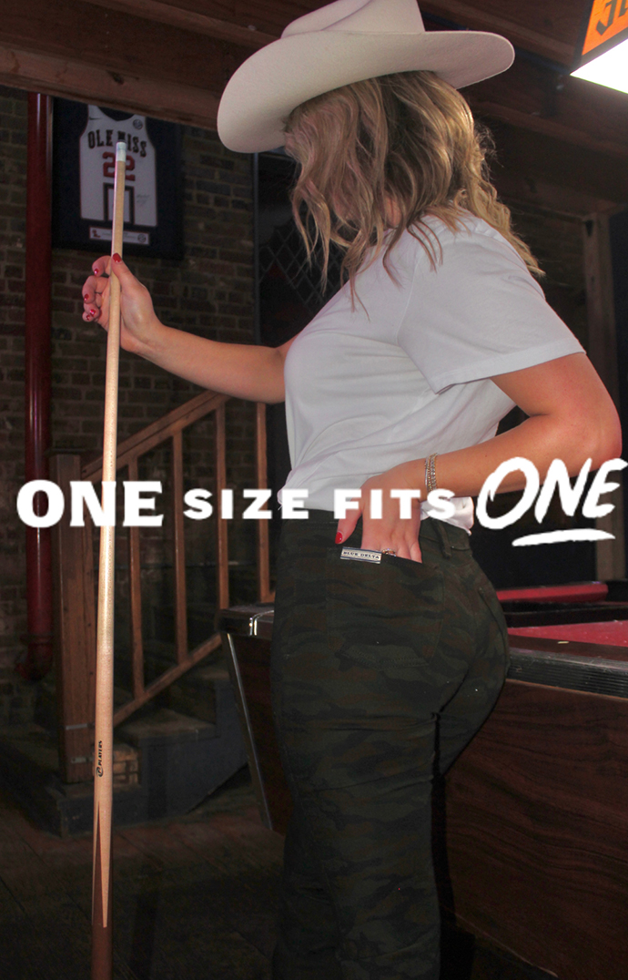 A woman models a pair of custom jeans in a social media ad.