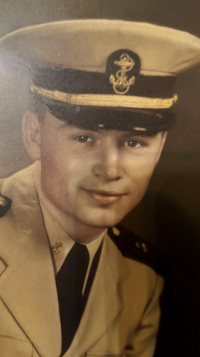 Headshot of a young man wearing a U.S. Navy dress uniform.