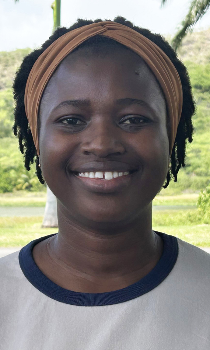 Headshot of a woman wearing a white T-shirt with a black ring around the neck.