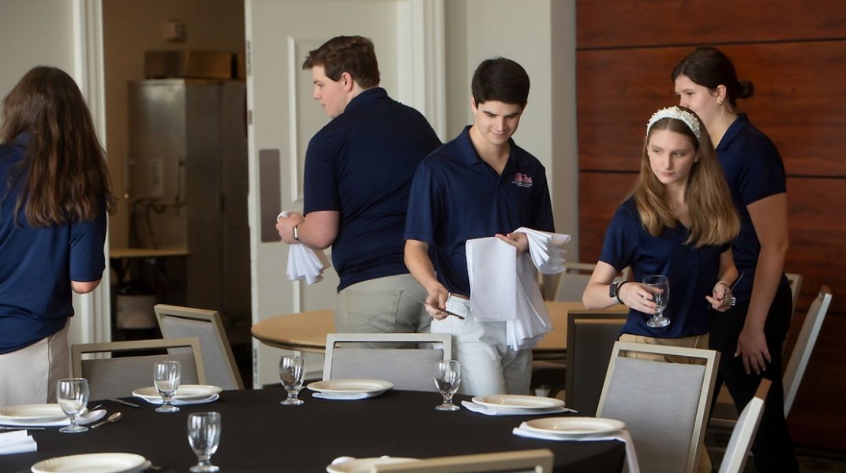Master in Science of Food and Nutrition Services students preparing for hospitality event. 