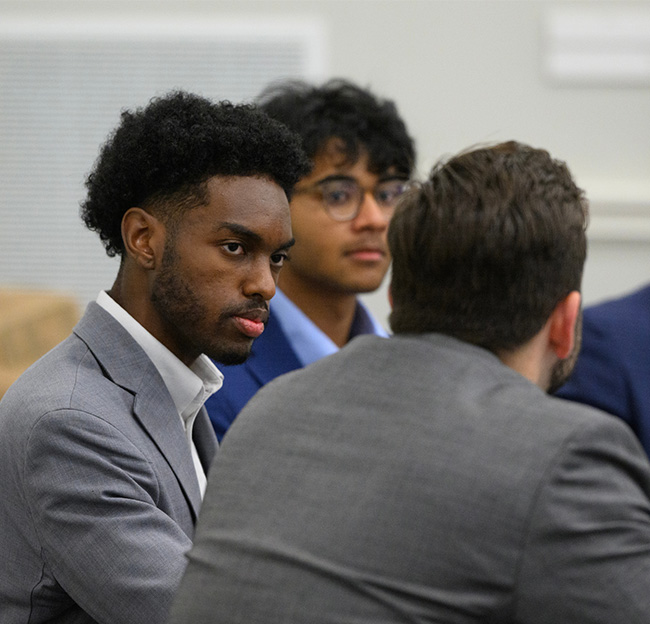An Ole Miss student takes part in a group discussion with fellow students.