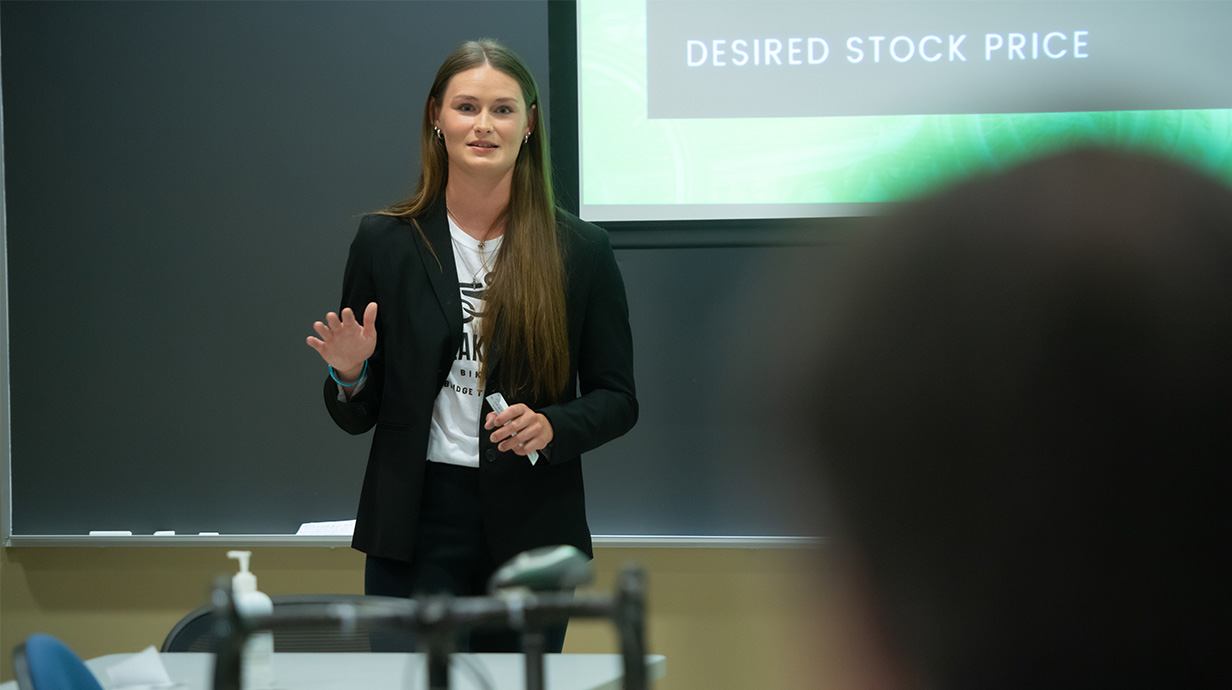 A Business student gives a presentation during the MBA Venture Capital Fair-Simulation