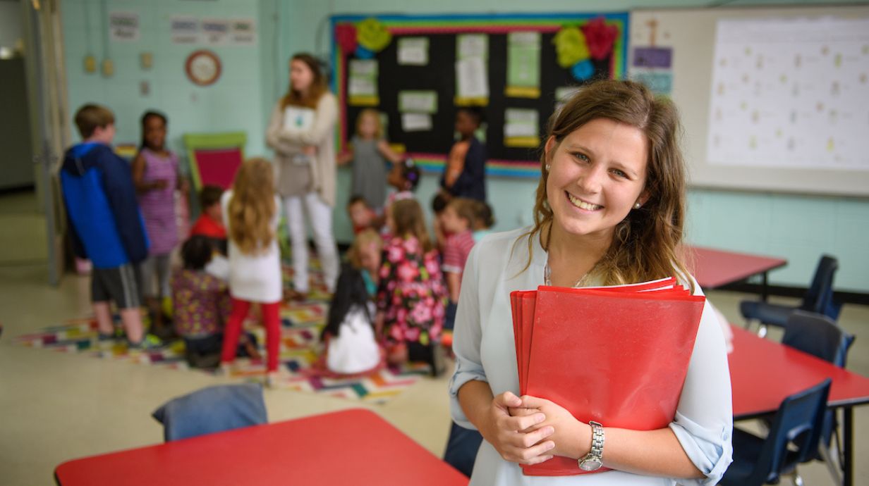 Certificate in Emotional Disability - teacher stands in a classroom. 