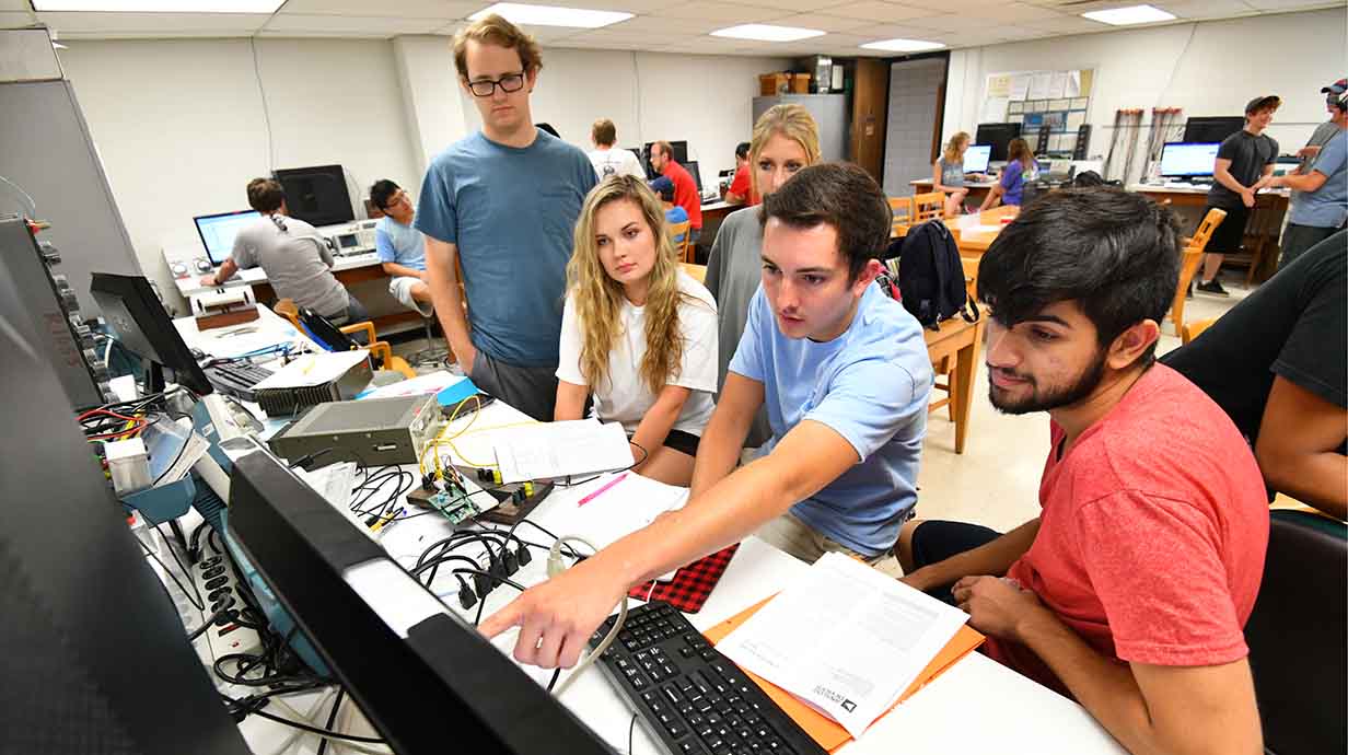 Ole Miss computer engineering students work in the microprocessor lab.