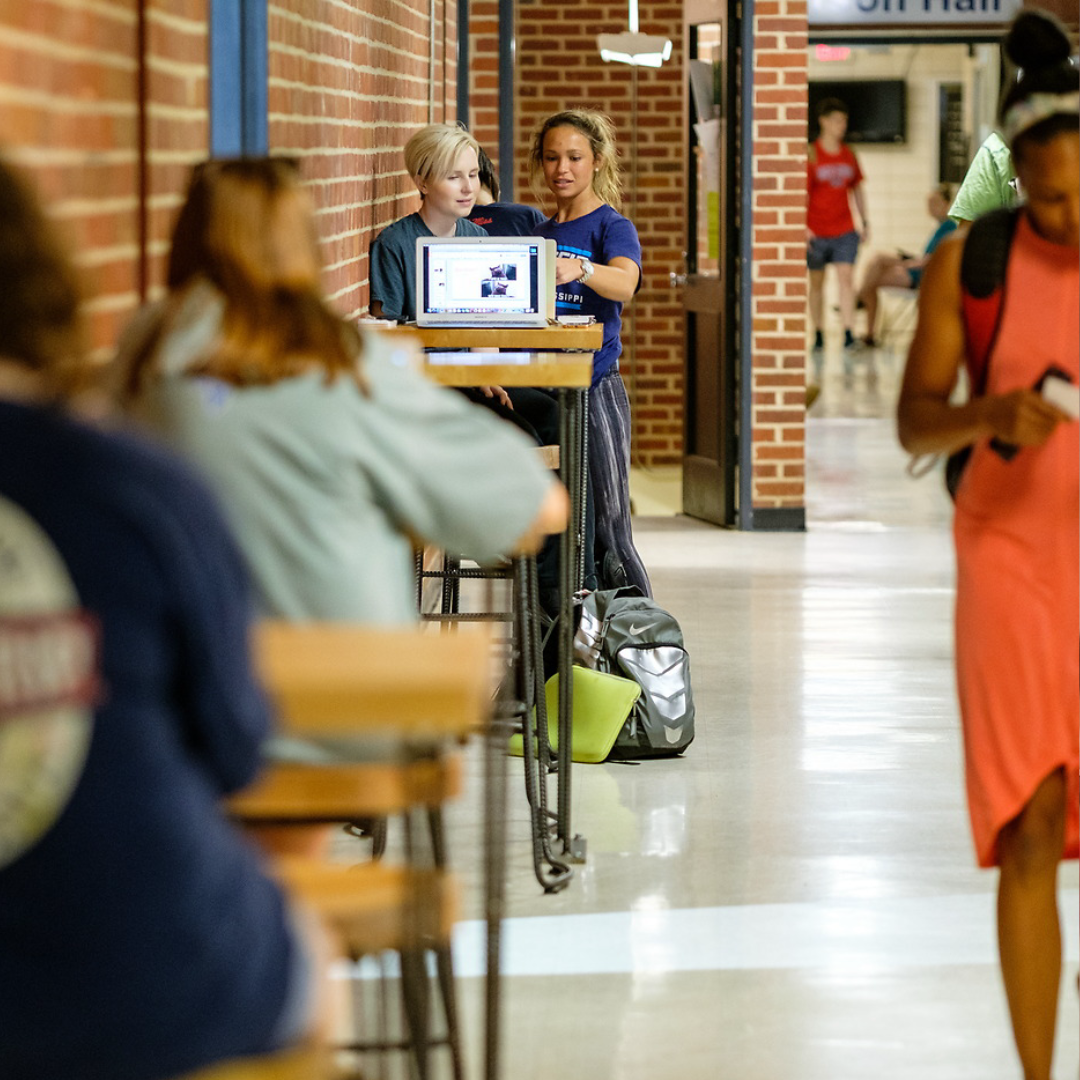 Students walking in hallway between Anderson and Carrier Hall on University of Mississippi campus