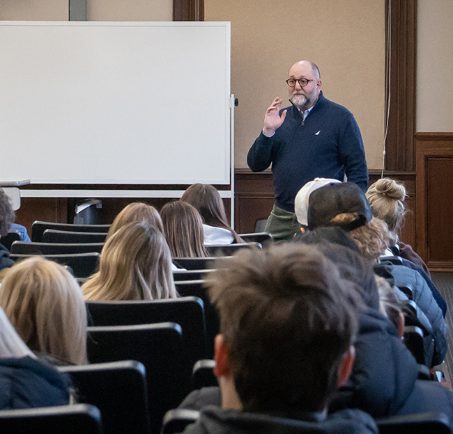 Professor John Baker teaching a course