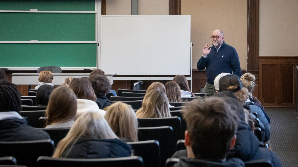 Professor talks to classroom of students