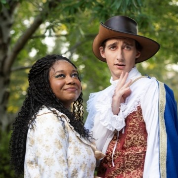 image of two students in medieval theatre costumes