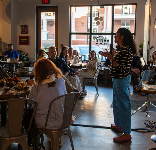 Instructor speaking at a conference about english