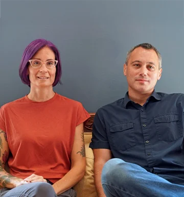 two people sitting next to each other