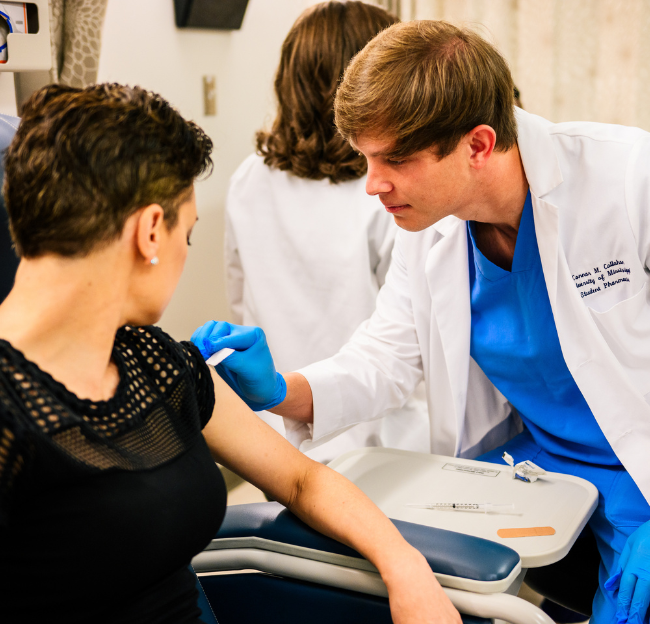 student giving an immunization
