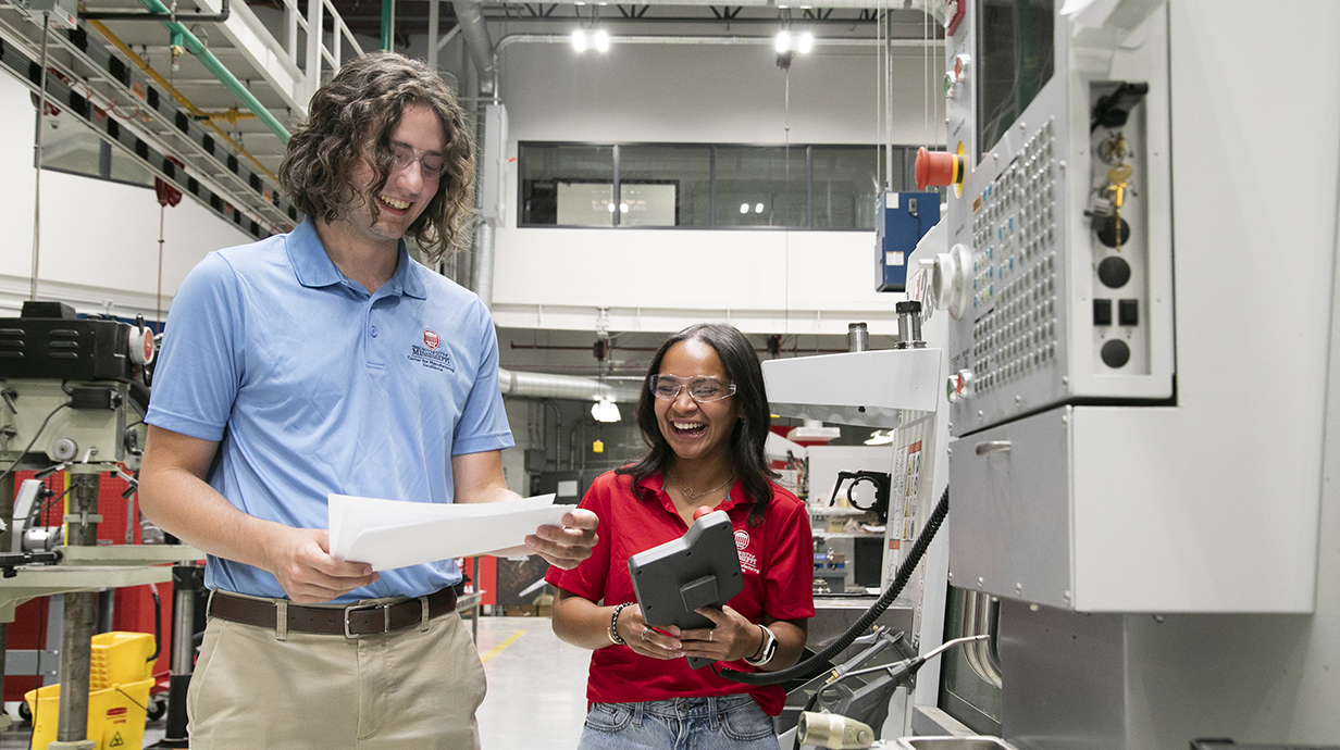 Two students working in the center for manufacturing excellence
