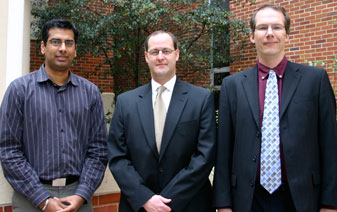 Rahul Khanna (left), Michael Warren and Robert Doerksen were recognized at the fall faculty retreat for their research, innovation and service.