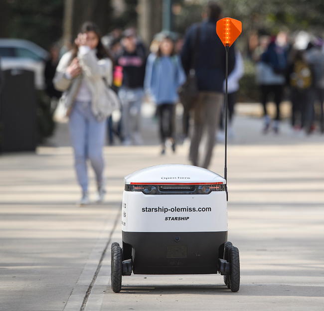 A Starship robot on its way delivering meals on campus to Ole Miss students.