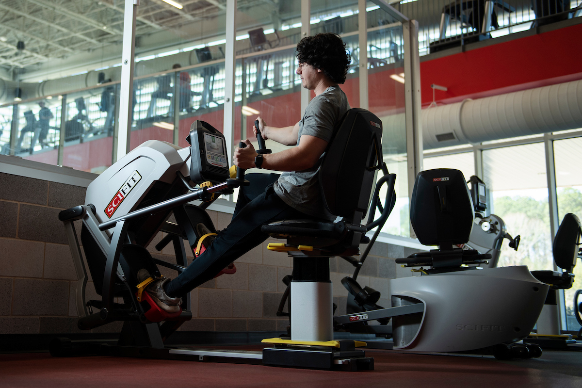 A student uses exercise equipment at the South Campus Recreation Center.