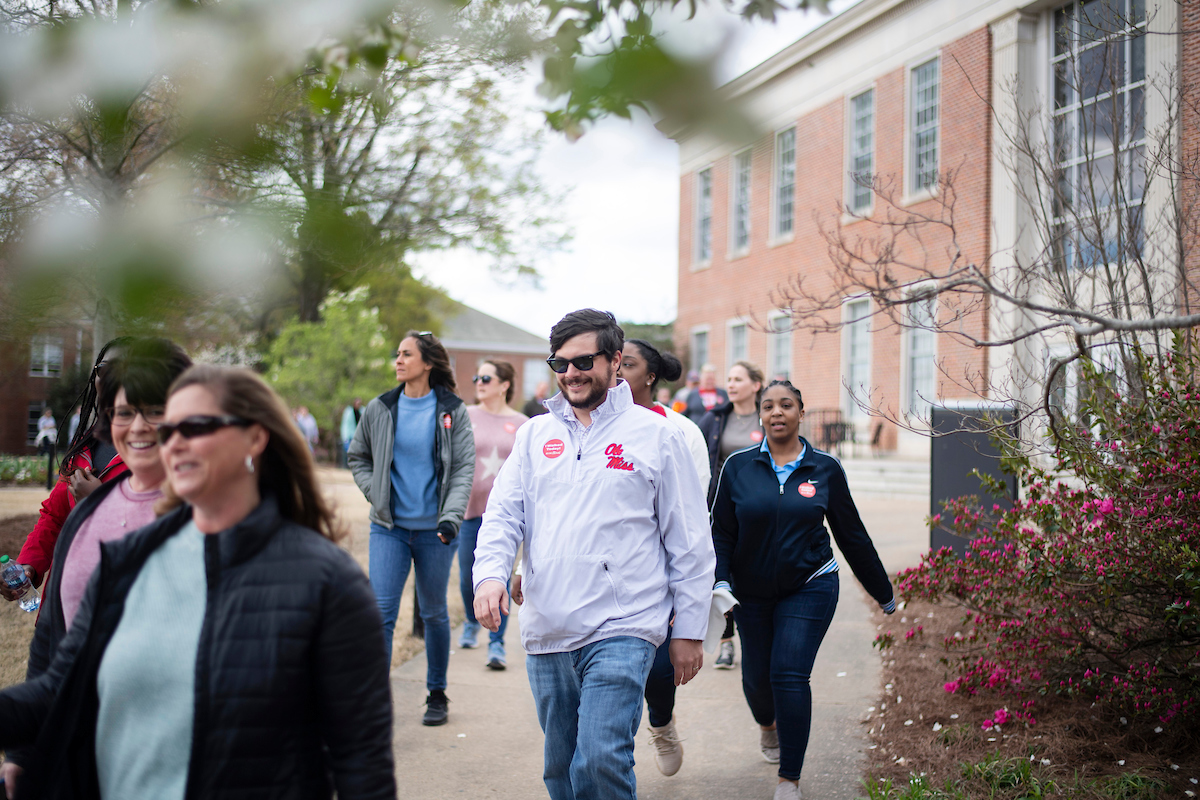 Ole Miss employees walking through campus during a National Walking Day event.