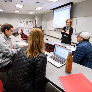 Kathleen Wickham talks to students in her Journalism 575 winter intersession class