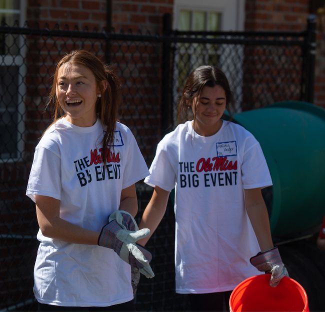 Students work with big event volunteers