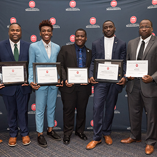 NPHC Fraternity members pose with awards at the 2019 Greek Awards at The Inn 