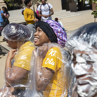 Members of Sigma Gamma Rho participate in a pie-in-the-face fundraiser